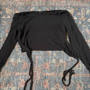 two long sleeve crops and a tank